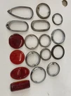 Lot Of 17 Vintage Antique Tail Light Bezel Trim Rings Lens. Fixed Price $50.00.